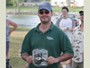 Angler Scott Zollo displays a reel he won during the prize raffle.