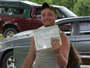 Adam Sacco displays his award for biggest catfish (5 lb, 6 oz).