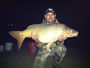 Paul Dinea (peg 20) with the tournament's largest common thus far, 31.6 lb.