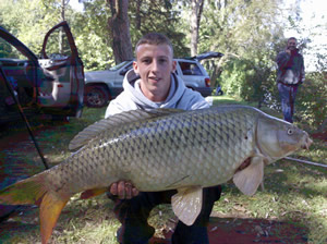 Sean Lehrer displays a nice 18 lb 6 oz Common caught during Session 4 of Wild Carp Club