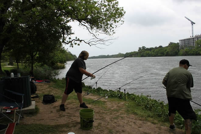 Phoenix Van Auken reeling in his catch during Session 4 f the Wild Carp Club of Austin