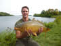 Eric Cabana with a 15.4 lb common caught during Session 4.