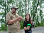 16-Taylor Talbot reeling in her first carp with some help from Daniel Maravalle.