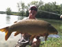 Paul Russell with a 25.15 lb common, his largest carp of the day.