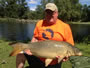 Fred Pickard with a soon-to-be hour 7 winning 32.0 lb common from the August 18 Shootout in Liverpool, NY.