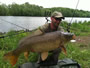 Marcin Syzdlowski with a 22.8 lb common from the Total Weight Challenge.