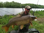 Marcin Szydlowski with a common carp caught during the 2012 Wild Carp Week Triathlon in Baldwinsville, NY.